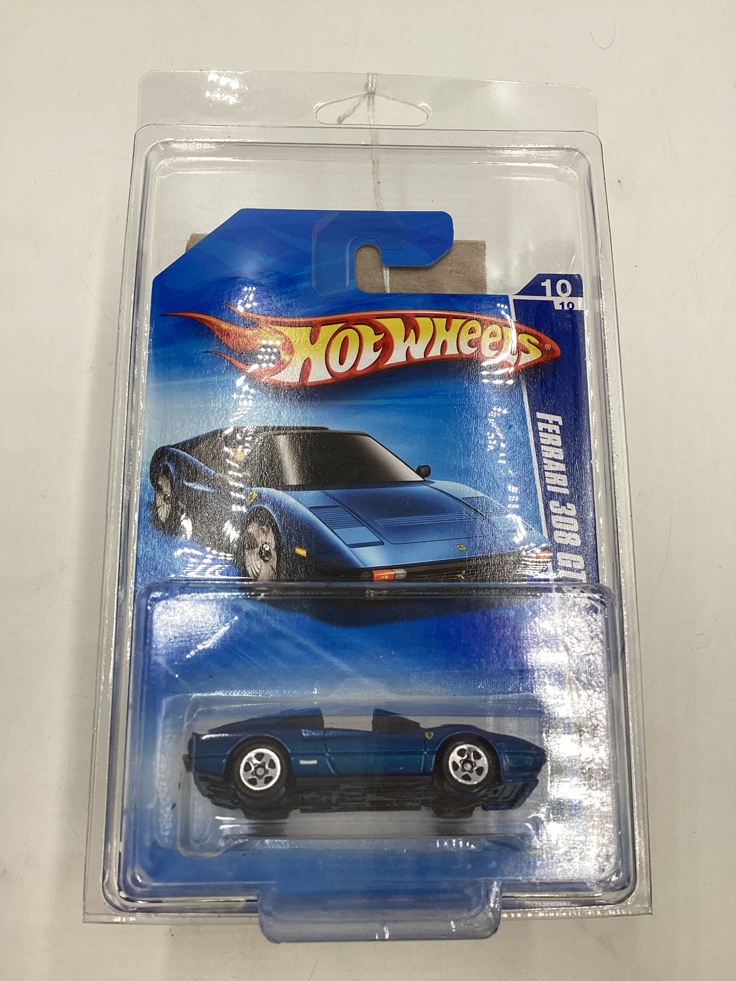 2010 Hot Wheels #128 Blue Ferrari 308 GTS with protector